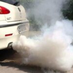 Thick white smoke from exhaust when starting car due to coolant leak